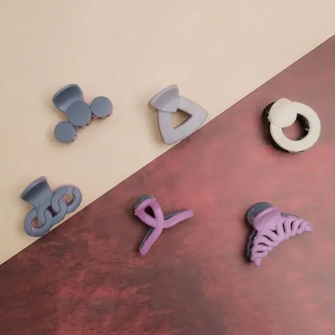 A second salon room, a tray of hair clips, and two finished hair styles (2)